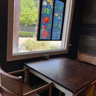 Lovely place to dine at a tables with stained glass art!