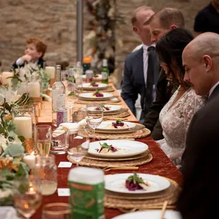 people sitting at a long table