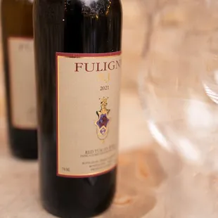 two bottles of wine on a table