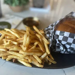 a plate of french fries and a sandwich