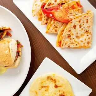 Appetizers include Lobster quesadillas, fresh made pupusas, wings and more