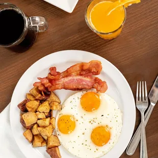 Big Scratch; 3 farm fresh eggs, crispy bacon, seasoned breakfast potatoes and a fluffy pancake