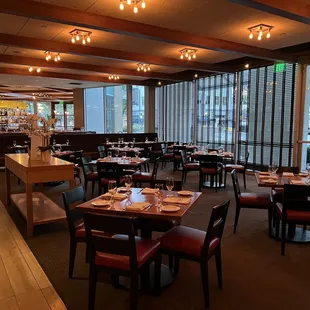 a dining area with tables and chairs