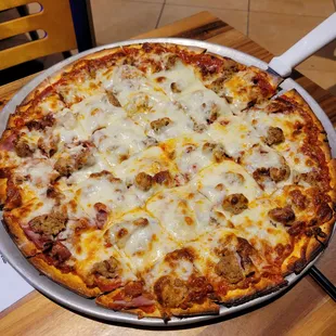 a pizza with meat and cheese