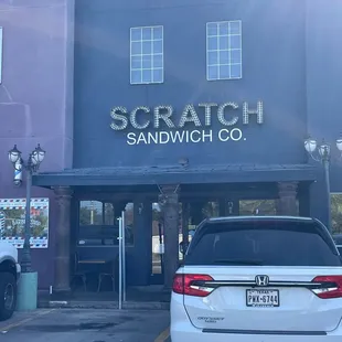 a car parked in front of a building
