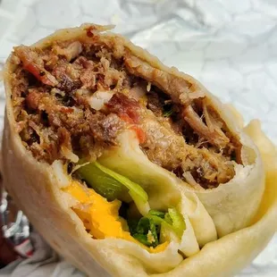 First bite into their brisket burrito