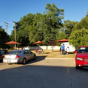 2020-07-13. Screamers Ice Cream, Sterling Heights, MI. Rear Parking lot with seating beyond.