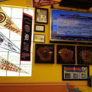 Cute table indoor area, with tv. Tons of old tigers stuff and the game is on