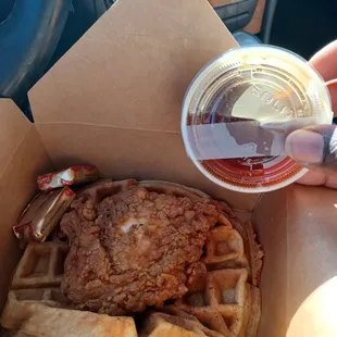 a person pouring syrup into a cup