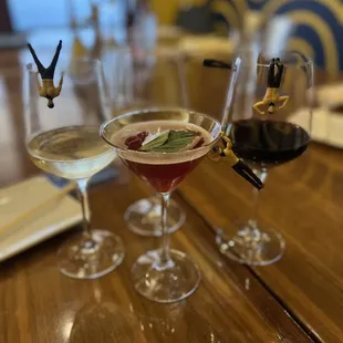 three glasses of wine on a table