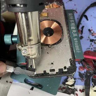 Back glass on an iPhone 11 getting repaired