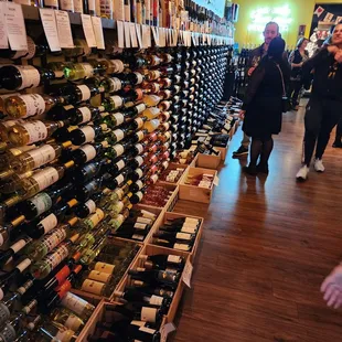 a large selection of wine bottles