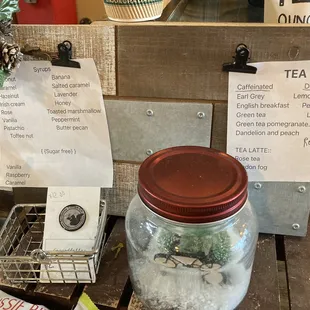 a jar of tea and a sign