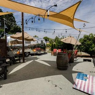 patio area with chairs and umbrellas
