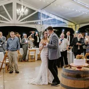 a bride and groom sharing their first dance
