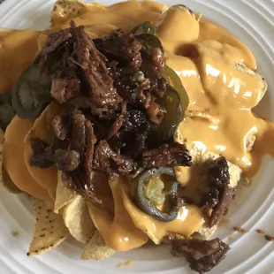 Brisket atop of nachos.