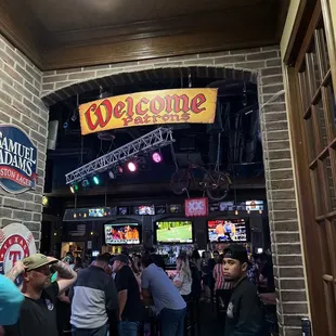 a crowd of people at a bar