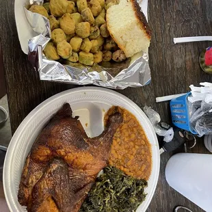 Half chicken plate with greens, baked beans, fried okra, and cornbread