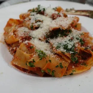 a plate of pasta with parmesan cheese