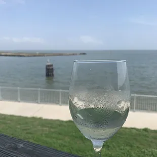a glass of wine on a table