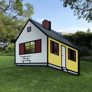 a white house with red shutters
