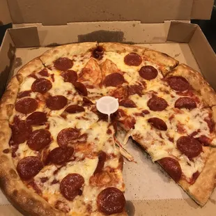 a pepperoni pizza in a box