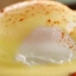 a person holding a piece of food