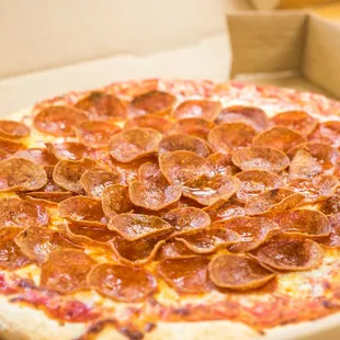 a pepperoni pizza in a box