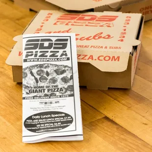 a box of pizza and a packet of pizza