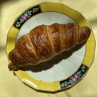 a croissant on a plate