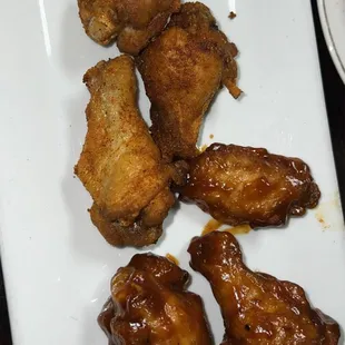 a plate of fried chicken wings