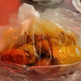 Sea Boil lobster dish served in a plastic bag. It had one pound of lobster tails ( 2 tails).