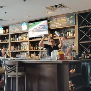 Bartender was very busy making adult beverages.