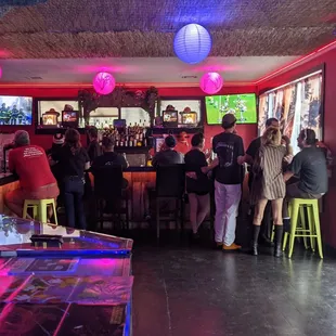 a group of people sitting at a bar