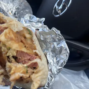 Breakfast burrito with sausage and bacon