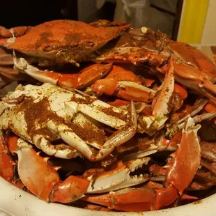 a bowl full of crabs on a table