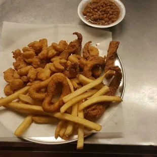 a plate of fried fish and fries