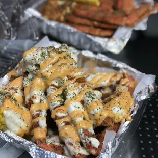 Fried season crab legs with our homemade creamy garlic butter sauce and our special seaisland sauce