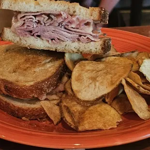 a sandwich and chips on a plate
