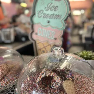 an ice cream cone with sprinkles