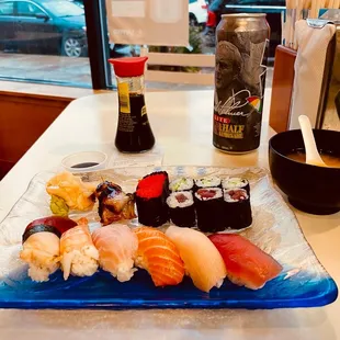 a plate of sushi and sauces