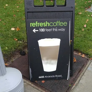 a cup of coffee on the sidewalk