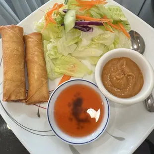 A5. Crispy Pork Egg Rolls (4) served with salad and peanut sauce