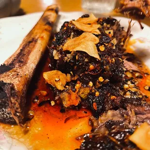 a plate of food with meat and vegetables