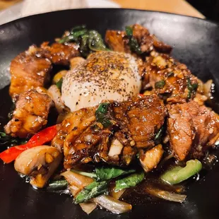 a plate of food with meat and vegetables