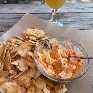 Pimento cheese with crispy chips and a hazy IPA