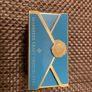 a blue envelope with a gold seal