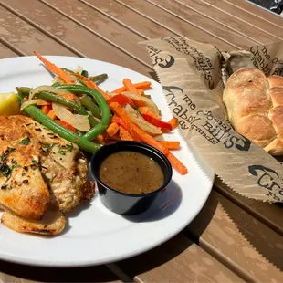 Whitefish stuffed with crab, veggie medley, and bread and butter.