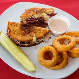 a sandwich and onion rings