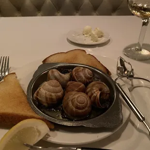 a plate of snails and bread